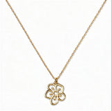 A Hawthorn May Flower Pendant Necklace by Skōsh Jewelry, featuring an open cutout hawthorn flower pendant on a fine gold chain, displayed against a white background.