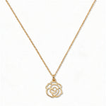 A Rose June Flower Pendant Necklace by Skōsh Jewelry, featuring an open cutout rose flower pendant on a fine gold chain, displayed against a white background.