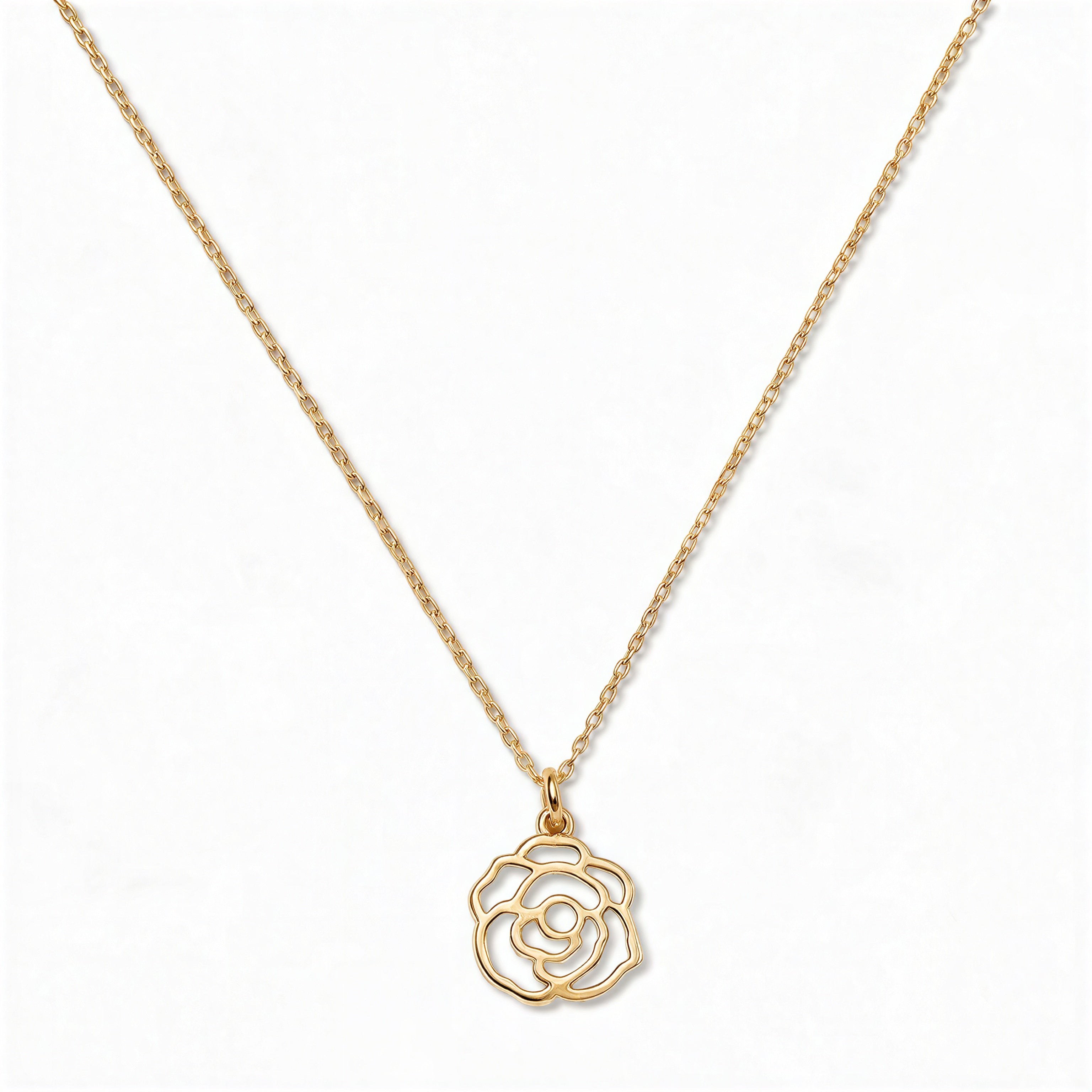 A Rose June Flower Pendant Necklace by Skōsh Jewelry, featuring an open cutout rose flower pendant on a fine gold chain, displayed against a white background.