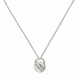 A Loved & Never Alone Bird Pendant Necklace by Skōsh Jewelry, featuring a rounded pendant with a cutout of a small bird on a fine sterling silver chain, displayed against a white background.