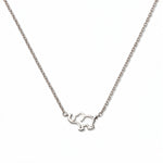 A Never Forget Elephant Necklace by Skōsh Jewelry, featuring an open outline of a small elephant set sideways on a fine sterling silver chain, displayed against a white background.