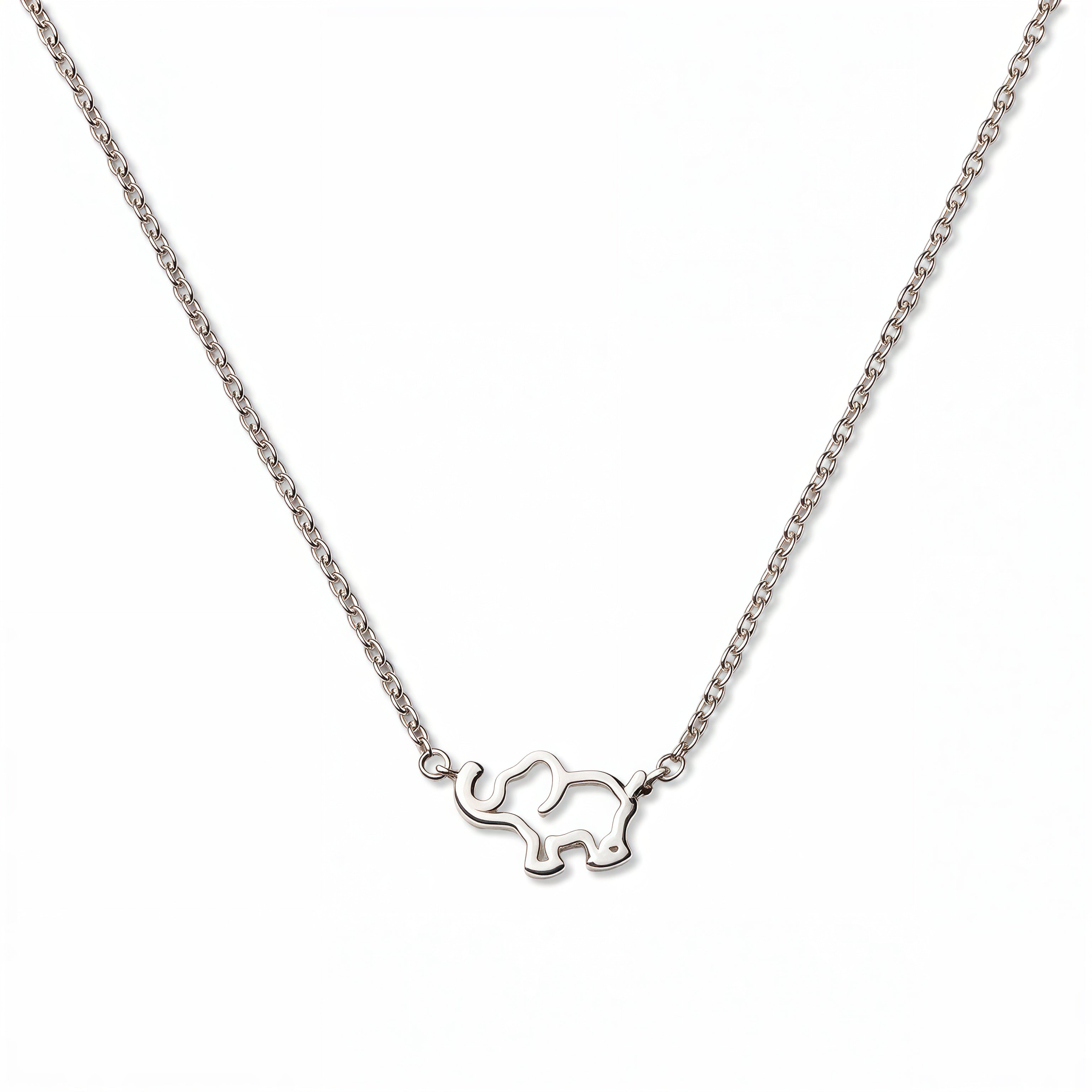 A Never Forget Elephant Necklace by Skōsh Jewelry, featuring an open outline of a small elephant set sideways on a fine sterling silver chain, displayed against a white background.