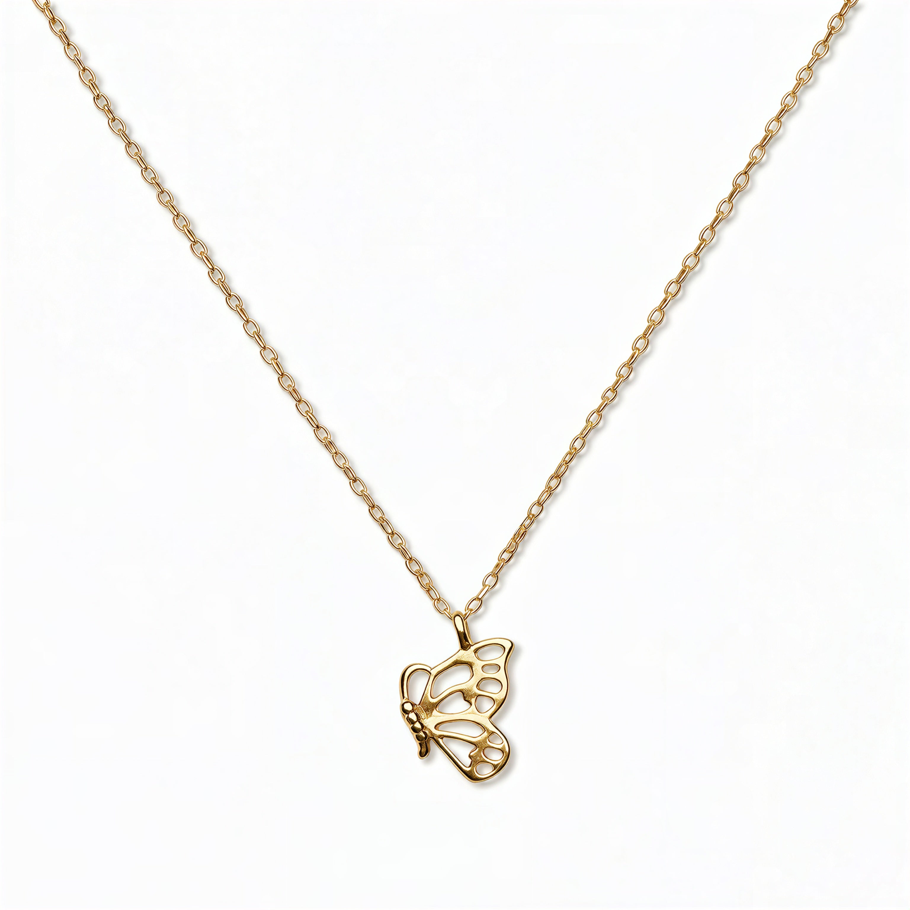 A Hope Butterfly Pendant Necklace by Skōsh Jewelry, featuring a small butterfly pendant on a fine gold chain, displayed against a white background.