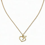 A Peach Pendant Necklace by Skōsh Jewelry, featuring an open outline of a peach with a leaf on a fine gold chain, displayed against a white background.