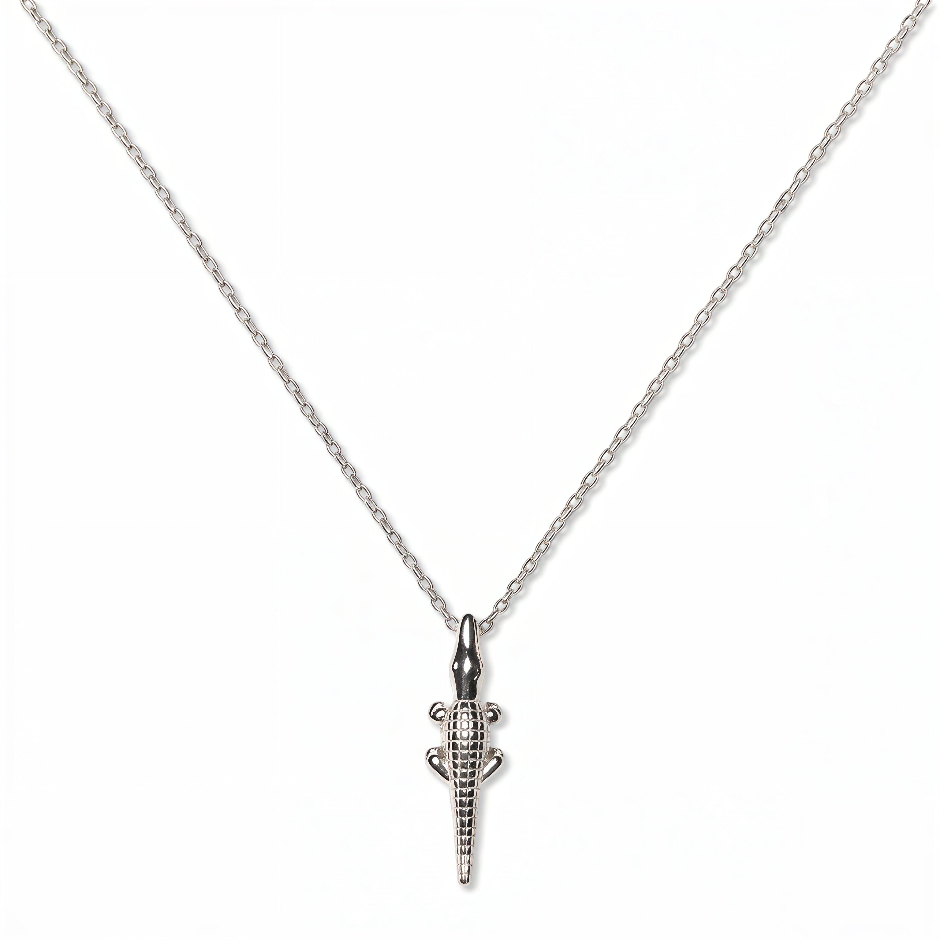 A See You Later Alligator Pendant Necklace by Skōsh Jewelry, featuring a slim alligator pendant hanging vertically on a fine sterling silver chain, displayed against a white background.