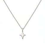 A Starlight Pendant Necklace by Skōsh Jewelry, featuring a sleek four-point star pendant on a fine sterling silver chain, displayed against a white background.