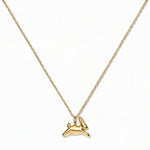A New Beginnings Rabbit Pendant Necklace by Skōsh Jewelry, featuring a small leaping rabbit pendant on a fine gold chain, displayed against a white background.