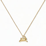 A New Beginnings Rabbit Pendant Necklace by Skōsh Jewelry, featuring a small leaping rabbit pendant on a fine gold chain, displayed against a white background.