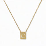An Engraved Initial Necklace Letter O by Skōsh Jewelry, featuring a small rectangular tag engraved with the letter O on a fine gold chain, displayed against a white background.
