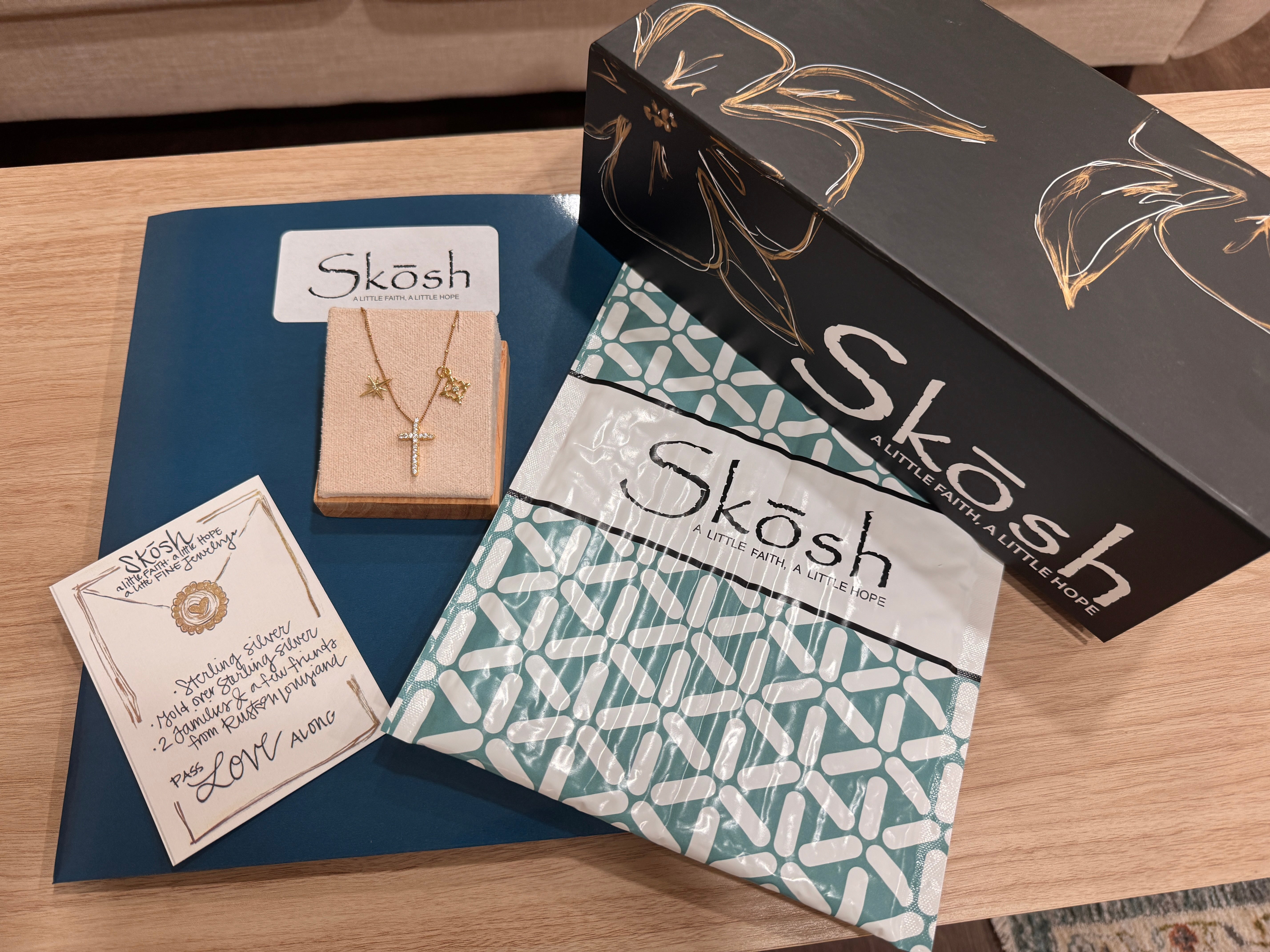 Skōsh Jewelry packaging with a gift box, pouch and necklace card