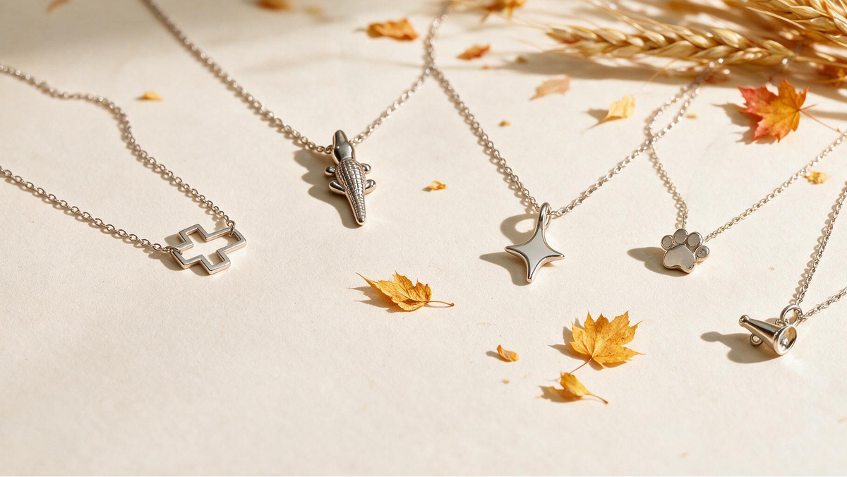 Sterling silver game day charm necklaces by Skōsh Jewelry with autumn leaves and wheat